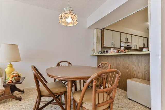 dining space featuring baseboards