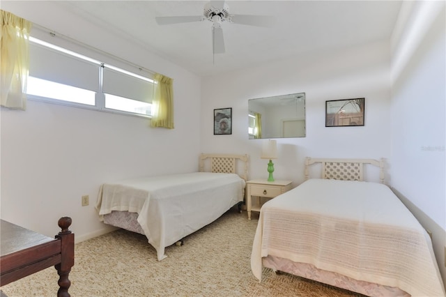 carpeted bedroom with a ceiling fan