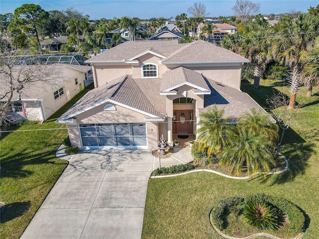 9 Cedar Hollow Ct, Palm Coast, FL 32137 - view of front of property with driveway, stucco siding, an attached garage, and a front lawn
