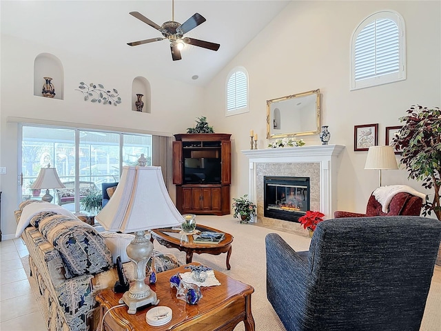 9 Cedar Hollow Ct, Palm Coast, FL 32137 - living area with high vaulted ceiling, a tile fireplace, ceiling fan, and a wealth of natural light