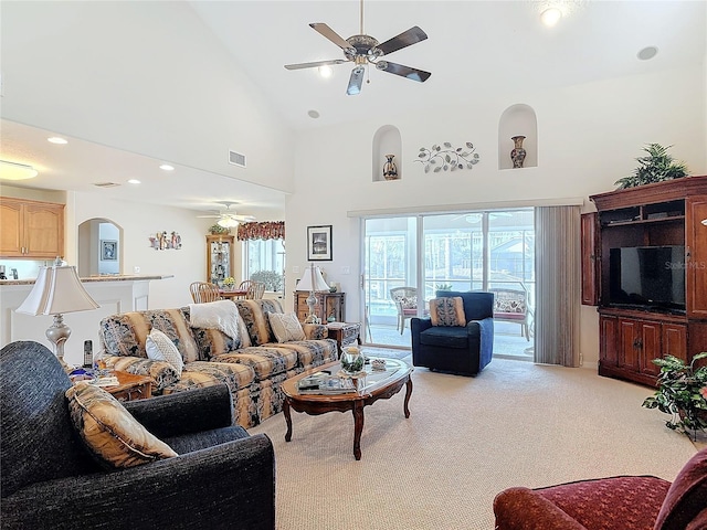 9 Cedar Hollow Ct, Palm Coast, FL 32137 - living area with high vaulted ceiling, visible vents, ceiling fan, recessed lighting, and light colored carpet