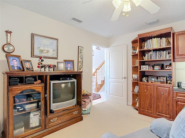 9 Cedar Hollow Ct, Palm Coast, FL 32137 - interior space featuring light carpet, a textured ceiling, visible vents, and a ceiling fan
