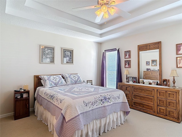 9 Cedar Hollow Ct, Palm Coast, FL 32137 - bedroom featuring a tray ceiling, baseboards, light carpet, and a textured ceiling