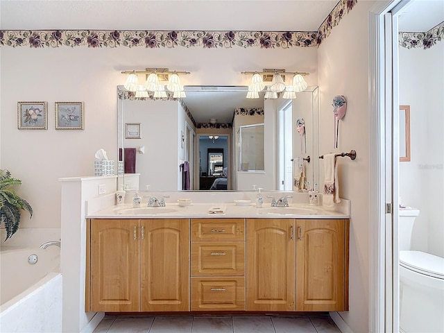 9 Cedar Hollow Ct, Palm Coast, FL 32137 - full bath with double vanity, a sink, tile patterned floors, and a garden tub