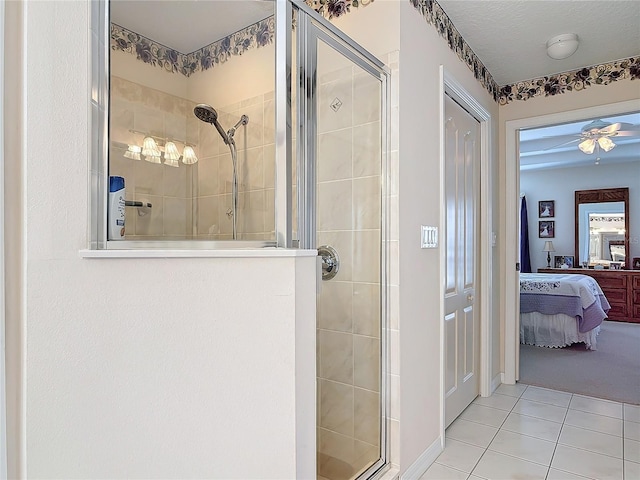 9 Cedar Hollow Ct, Palm Coast, FL 32137 - ensuite bathroom with ensuite bath, ceiling fan, tile patterned flooring, and a shower stall