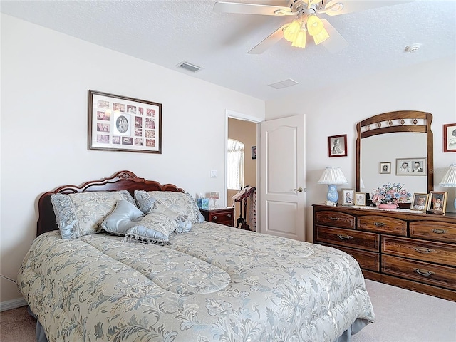 9 Cedar Hollow Ct, Palm Coast, FL 32137 - carpeted bedroom with visible vents, a ceiling fan, and a textured ceiling