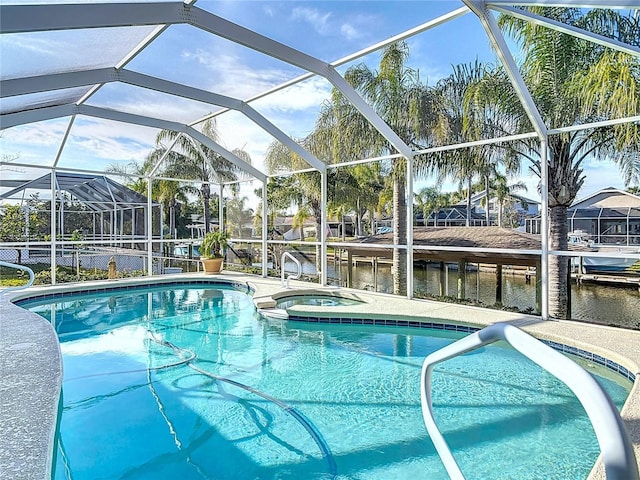 9 Cedar Hollow Ct, Palm Coast, FL 32137 - view of pool featuring a pool with connected hot tub and a lanai