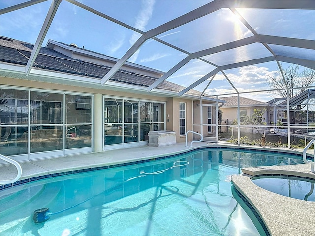9 Cedar Hollow Ct, Palm Coast, FL 32137 - view of swimming pool with a pool with connected hot tub, glass enclosure, and a patio area