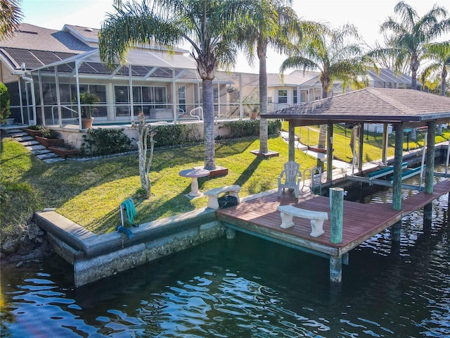 9 Cedar Hollow Ct, Palm Coast, FL 32137 - view of dock with a lanai, a water view, boat lift, and a yard