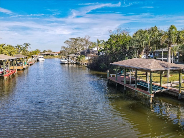 9 Cedar Hollow Ct, Palm Coast, FL 32137 - view of dock featuring boat lift and a water view