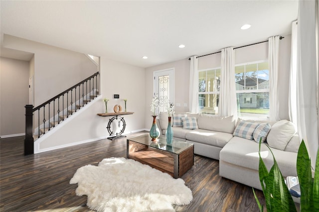 living room with stairs, recessed lighting, and wood finished floors