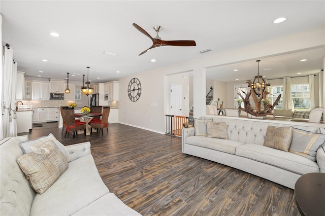 living area featuring dark wood-style floors, recessed lighting, baseboards, and ceiling fan