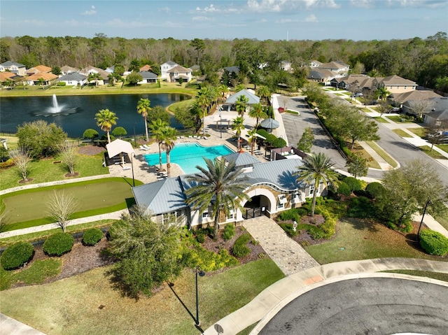 birds eye view of property featuring a residential view and a water view