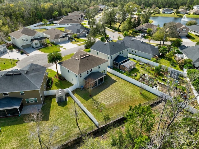 aerial view with a residential view and a water view