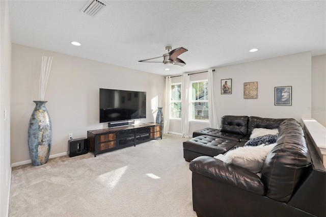 carpeted living room with recessed lighting, visible vents, baseboards, and a ceiling fan