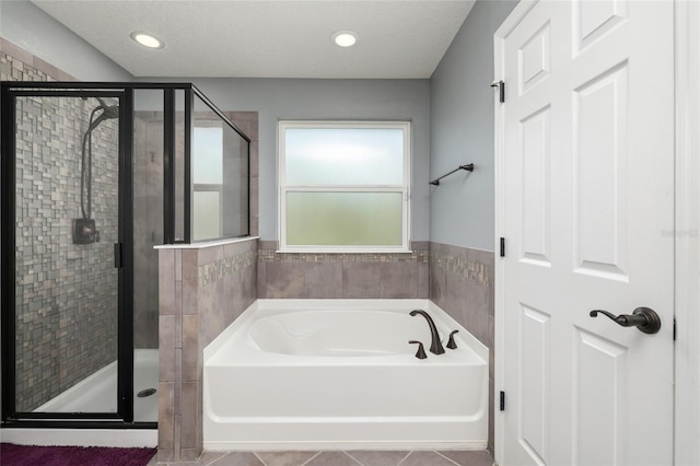 full bath featuring a garden tub, recessed lighting, a stall shower, and tile patterned floors