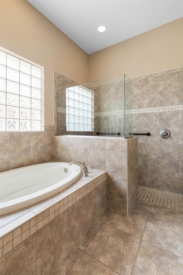 full bathroom with a garden tub and walk in shower