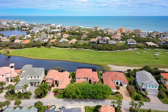 bird's eye view featuring view of golf course, a residential view, and a water view