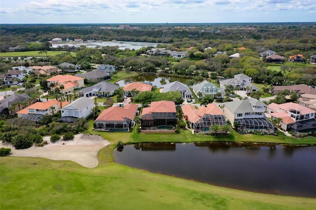 birds eye view of property with a water view and a residential view