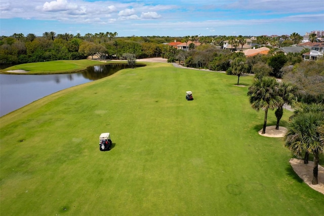 bird's eye view featuring view of golf course and a water view