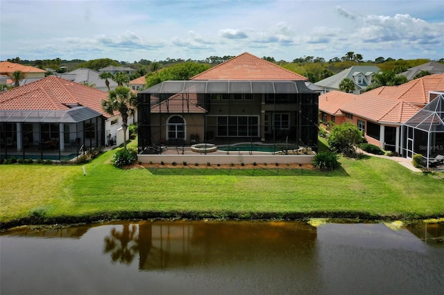 back of house with a water view, a lanai, an outdoor pool, a tile roof, and a yard