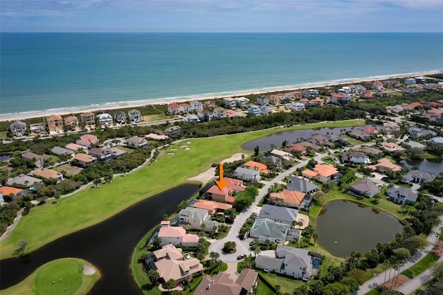 birds eye view of property with a residential view and a water view