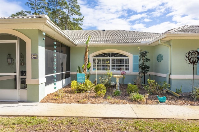 exterior space featuring a tile roof