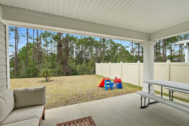 view of patio / terrace featuring fence