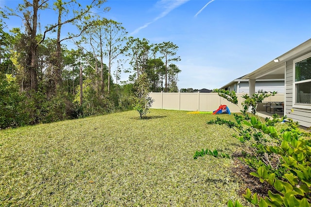 view of yard with fence