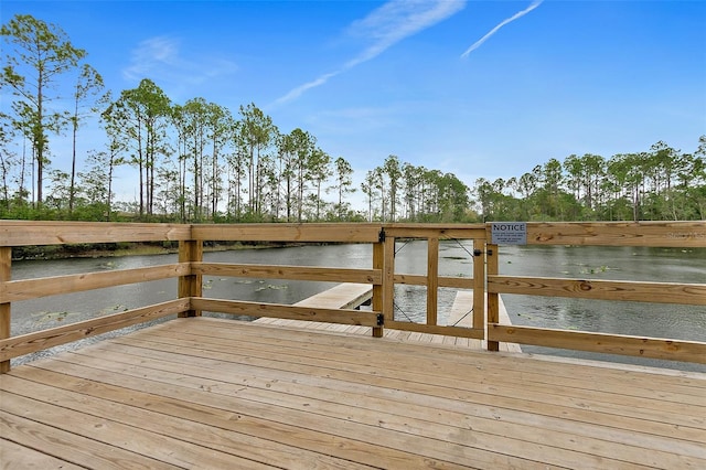 wooden terrace with a water view