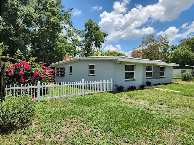 exterior space featuring a yard and fence