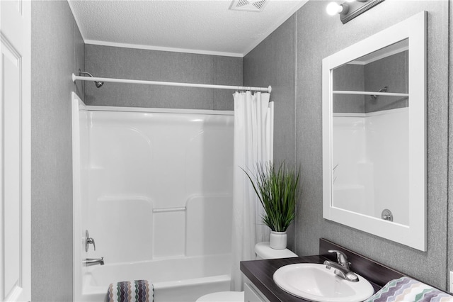 bathroom featuring visible vents, toilet, shower / bath combo with shower curtain, a textured ceiling, and vanity