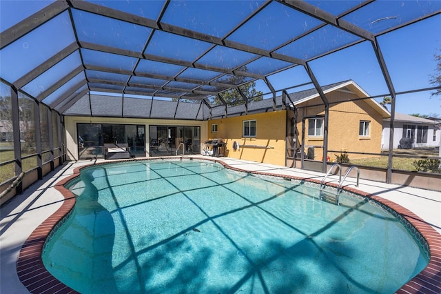 pool featuring a lanai and a patio area