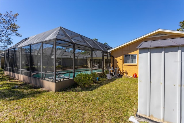 pool with a lanai and a yard