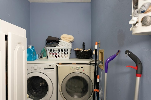 laundry area with laundry area and washer and clothes dryer