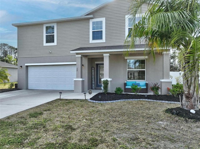 traditional-style home featuring covered porch, an attached garage, concrete driveway, and stucco siding