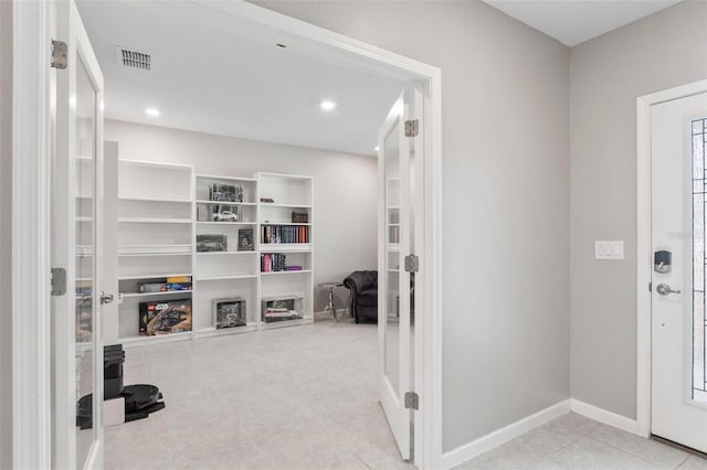 tiled foyer entrance with visible vents, recessed lighting, and baseboards