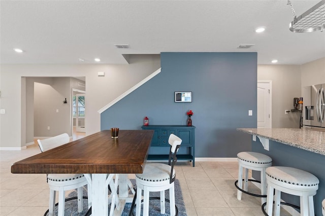 dining area with light tile patterned flooring, recessed lighting, and visible vents