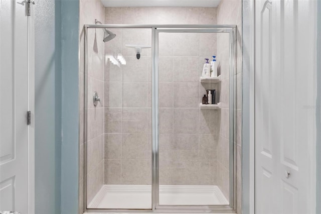 full bathroom with a stall shower