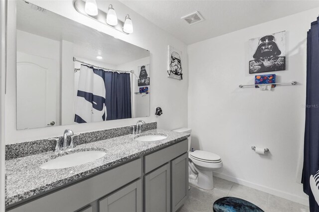 full bathroom with tile patterned flooring, toilet, visible vents, and a sink