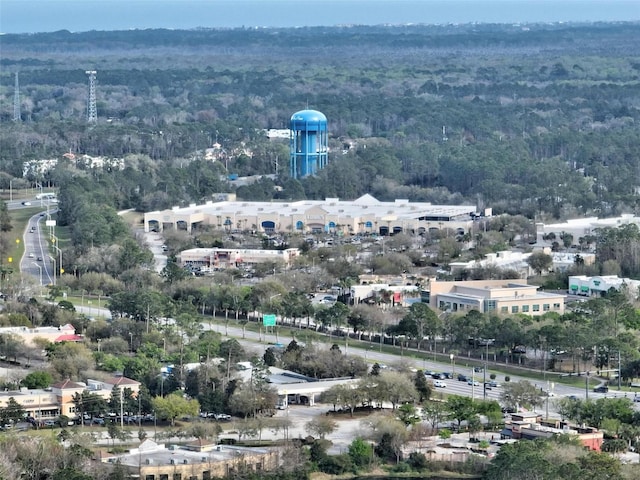 bird's eye view featuring a wooded view