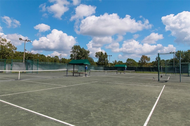 view of sport court with fence