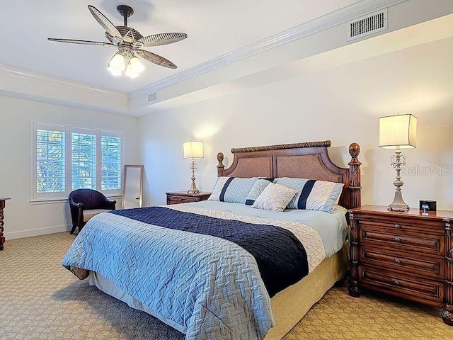 bedroom with crown molding, light colored carpet, and visible vents