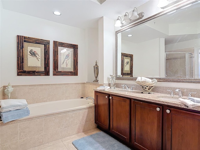 bathroom with tile patterned floors, a shower stall, a bath, and a sink