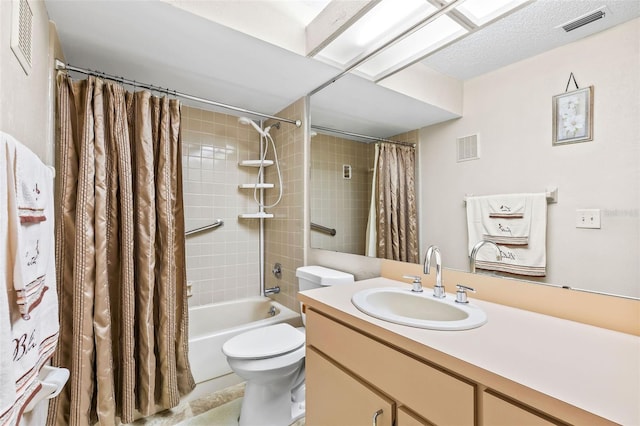 bathroom featuring visible vents, toilet, vanity, and shower / bath combo with shower curtain