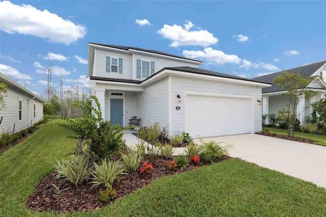 traditional home featuring a garage, concrete driveway, and a front lawn