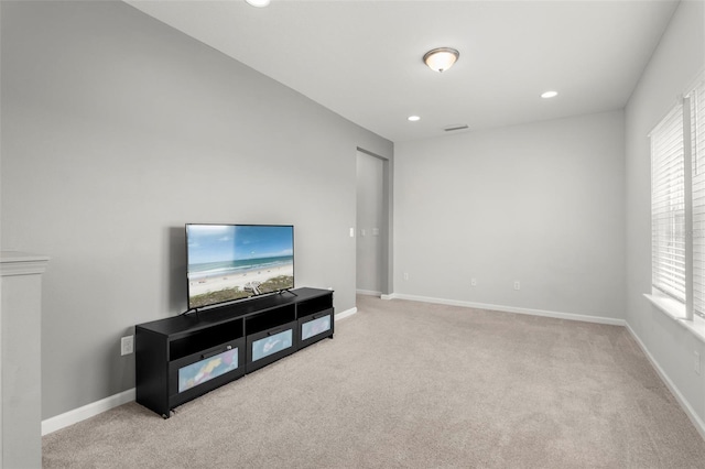 living area with recessed lighting, baseboards, carpet floors, and visible vents