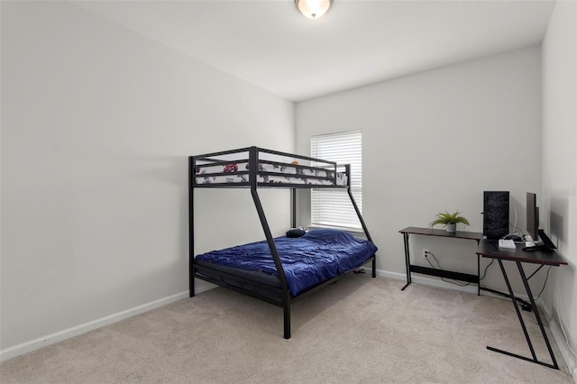 carpeted bedroom with baseboards