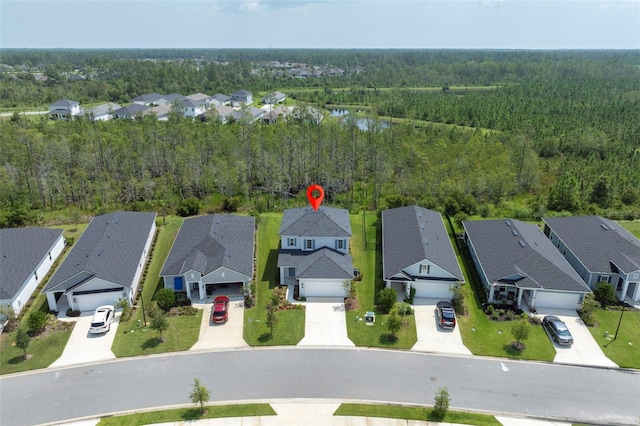 bird's eye view with a view of trees and a residential view