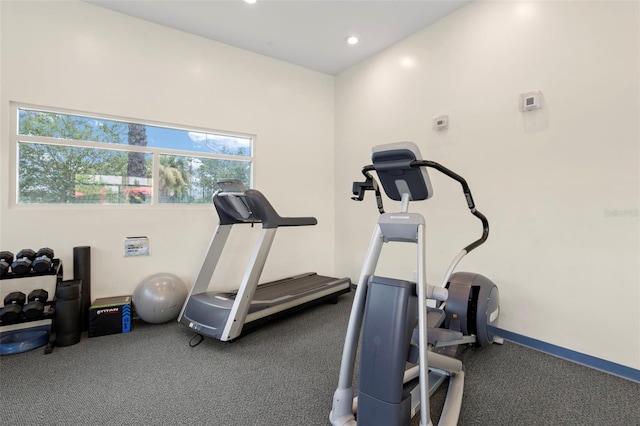 workout area featuring recessed lighting and baseboards